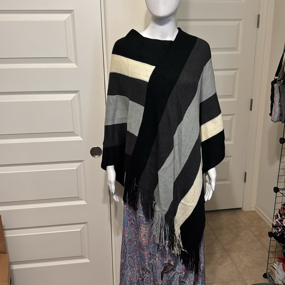 Black, grey, cream striped fringe poncho.